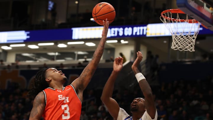 Dec 21, 2024; Pittsburgh, Pennsylvania, USA;  Sam Houston State Bearkats guard Lamar Wilkerson (3) shoots against Pittsburgh Panthers forward Zack Austin (55) during the second half at the Petersen Events Center. Mandatory Credit: Charles LeClaire-Imagn Images