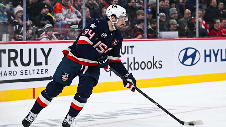 Feb 13, 2025; Montreal, Quebec, CAN; [Imagn Images direct customers only] Team USA forward Auston Matthews (34) plays the puck against Team Finland in the second period during a 4 Nations Face-Off ice hockey game at Bell Centre. Mandatory Credit: David Kirouac-Imagn Images