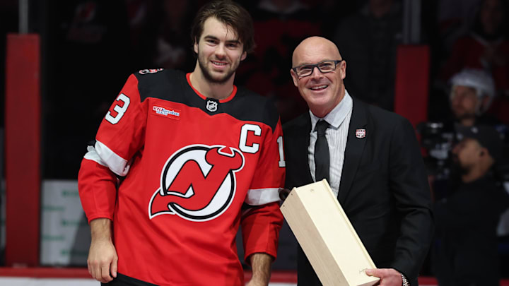 Former New Jersey Devil John MacLean poses with New Jersey Devils center Nico Hischier (13): Ed Mulholland-Imagn Images