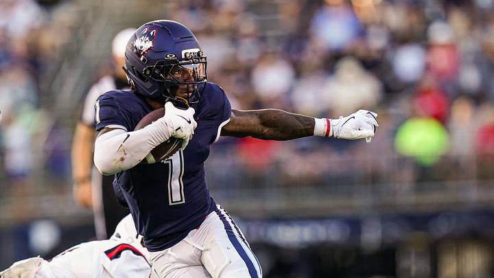 Sep 20, 2025; East Hartford, Connecticut, USA; Connecticut Huskies wide receiver Skyler Bell (1) runs the ball against et Ball State Cardinals in the second half at Pratt & Whitney Stadium at Rentschler Field. Mandatory Credit: David Butler II-Imagn Images