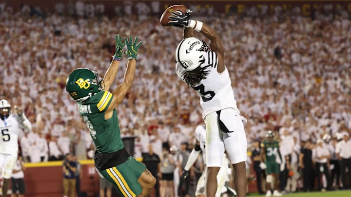 Oct 5, 2024; Ames, Iowa, USA; Iowa State Cyclones defensive back Jontez Williams (3) intercepts a pass intended for Baylor Bears wide receiver Monaray Baldwin (4) at Jack Trice Stadium. Mandatory Credit: Reese Strickland-Imagn Images Oct 5, 2024; Ames, Iowa, USA; Iowa State Cyclones defensive back Jontez Williams (3) intercepts a pass intended for Baylor Bears wide receiver Monaray Baldwin (4) at Jack Trice Stadium. Mandatory Credit: Reese Strickland-Imagn Images