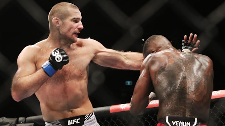 Sep 9, 2023; Sydney, NSW, AUSTRALIA; Israel Adesanya (red gloves) fights Sean Strickland (blue