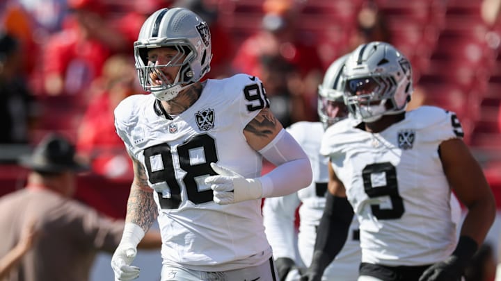 Dec 8, 2024; Tampa, Florida, USA; Las Vegas Raiders defensive end Maxx Crosby (98) takes the field for a game against the Tampa Bay Buccaneers at Raymond James Stadium. Mandatory Credit: Nathan Ray Seebeck-Imagn Images