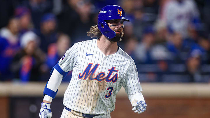 Oct 18, 2024; New York City, New York, USA; New York Mets left fielder Jesse Winker (3) singles during game five of the NLCS for the 2024 MLB playoffs against the Los Angeles Dodgers at Citi Field. Mandatory Credit: Vincent Carchietta-Imagn Images
