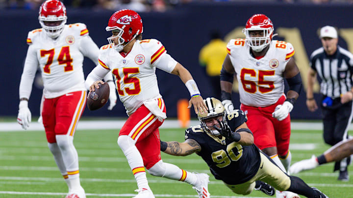 Aug 13, 2023; New Orleans, Louisiana, USA; New Orleans Saints defensive tackle Bryan Bresee (90) misses the tackle on Kansas City Chiefs quarterback Patrick Mahomes (15) during the first half at the Caesars Superdome. Mandatory Credit: Stephen Lew-Imagn Images