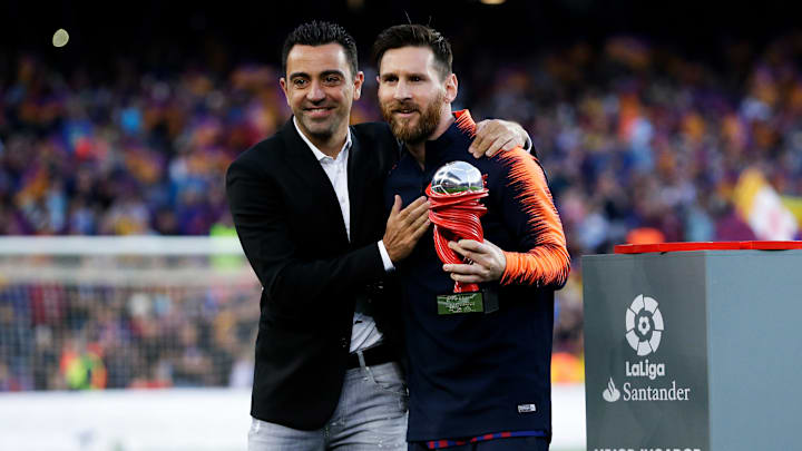 Xavi Hernández y Leo Messi