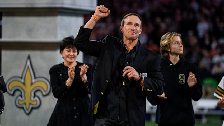 Brees celebrates being inducted into the New Orleans Saints Hall of Fame during a halftime ceremony at Caesars Superdome