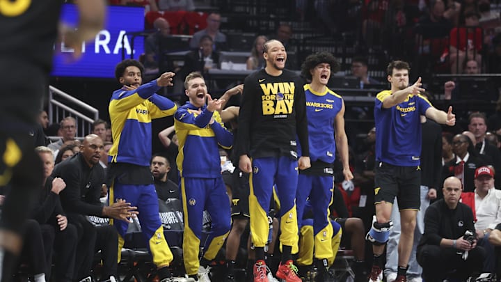 May 4, 2025; Houston, Texas, USA; Golden State Warriors bench players celebrate after a basket by guard Buddy Hield (not pictured) during the second quarter of game seven of the first round for the 2025 NBA Playoffs against the Houston Rockets  at Toyota Center. Mandatory Credit: Troy Taormina-Imagn Images