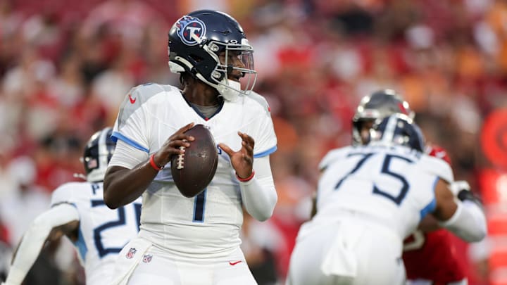 Aug 9, 2025; Tampa, Florida, USA; Tennessee Titans quarterback Cameron Ward (1) drops back to pass against the Tampa Bay Buccaneers in the first quarter during a preseason game at Raymond James Stadium. Mandatory Credit: Nathan Ray Seebeck-Imagn Images