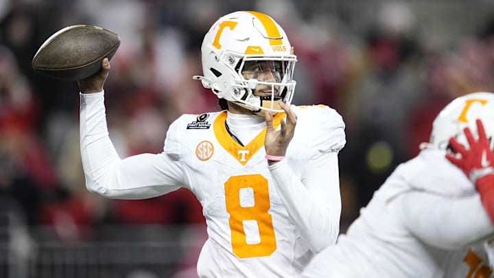 Dec 21, 2024; Columbus, Ohio, USA; Tennessee Volunteers quarterback Nico Iamaleava (8) throws against the Ohio State Buckeyes during the second half of the College Football Playoff first round game at Ohio Stadium. Ohio State won 42-17. Mandatory Credit: Adam Cairns-Imagn Images