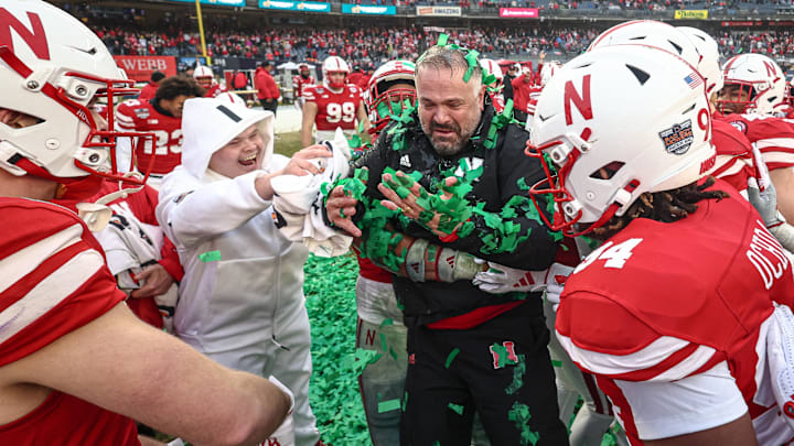 Nebraska head coach Matt Rhule celebrates with his team after beating Boston College in the 2024 Pinstripe Bowl