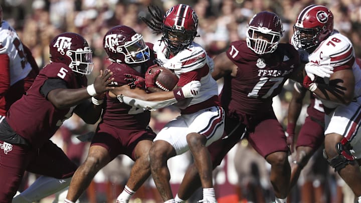 Nov 15, 2025; College Station, Texas, USA; Texas A&M Aggies linebacker Taurean York (21) tackles South Carolina Gamecocks running back Rahsul Faison (1) during the third quarter at Kyle Field. Mandatory Credit: Troy Taormina-Imagn Images Nov 15, 2025; College Station, Texas, USA; Texas A&M Aggies linebacker Taurean York (21) tackles South Carolina Gamecocks running back Rahsul Faison (1) during the third quarter at Kyle Field. Mandatory Credit: Troy Taormina-Imagn Images