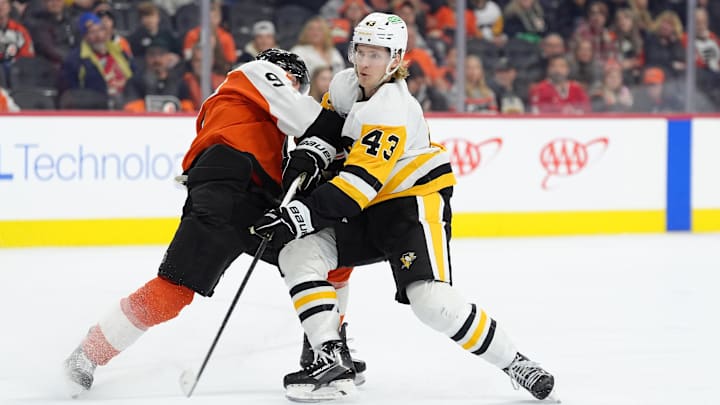 Feb 8, 2025; Philadelphia, Pennsylvania, USA; Philadelphia Flyers defenseman Jamie Drysdale (9) grabs Pittsburgh Penguins left wing Danton Heinen (43) during a shot in the third period at Wells Fargo Center. Mandatory Credit: Kyle Ross-Imagn Images