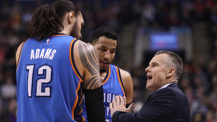 Mar 16, 2017; Toronto, Ontario, CAN; Oklahoma City Thunder head coach Billy Donovan talks to center Steven Adams (12) and forward Andre Roberson (21) against the Toronto Raptors at Air Canada Centre. The Thunder beat the Raptors 123-102. Mandatory Credit: Tom Szczerbowski-Imagn Images