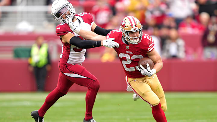 San Francisco 49ers running back Christian McCaffrey (23) stiff-arms Arizona Cardinals cornerback Jace Whittaker (39)
