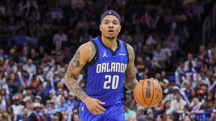 Apr 1, 2024; Orlando, Florida, USA; Orlando Magic guard Markelle Fultz (20) brings the ball up court during the second half against the Portland Trail Blazers at Amway Center. Mandatory Credit: Mike Watters-Imagn Images