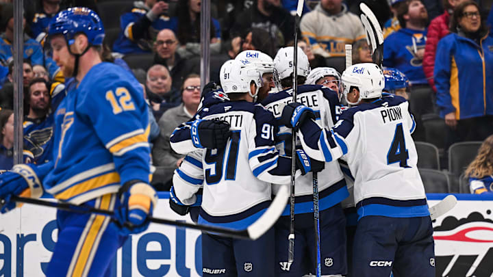 Feb 22, 2025; St. Louis, Missouri, USA; Winnipeg Jets center Gabriel Vilardi (13) celebrates with teammates after scoring agains the St. Louis Blues during the third period at Enterprise Center. Mandatory Credit: Connor Hamilton-Imagn Images