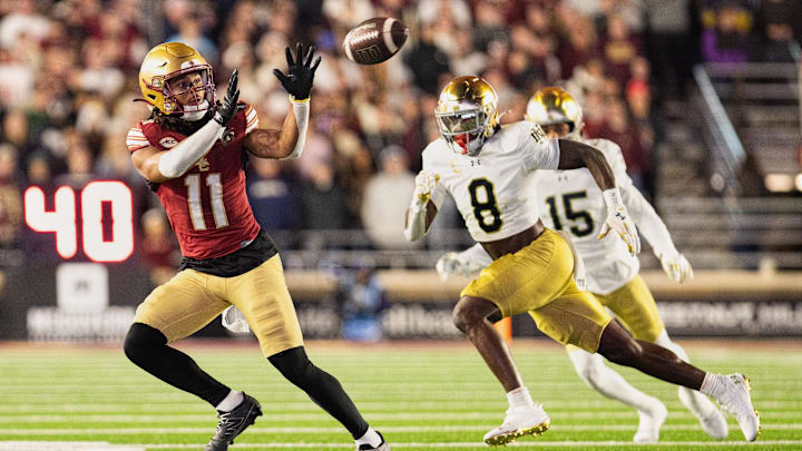 Nov 1, 2025; Chestnut Hill, Massachusetts, USA; Boston College Eagles wide receiver Lewis Bond (11) catches a pass against Notre Dame Fighting Irish safety Adon Shuler (8) in the fourth quarter at Alumni Stadium. Mandatory Credit: Edward Finan-Imagn Images Nov 1, 2025; Chestnut Hill, Massachusetts, USA; Boston College Eagles wide receiver Lewis Bond (11) catches a pass against Notre Dame Fighting Irish safety Adon Shuler (8) in the fourth quarter at Alumni Stadium. Mandatory Credit: Edward Finan-Imagn Images