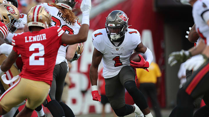 Nov 10, 2024; Tampa, Florida, USA; Tampa Bay Buccaneers running back Rachaad White (1) runs with the ball against the San Francisco 49ers during the first half at Raymond James Stadium. Mandatory Credit: Kim Klement Neitzel-Imagn Images