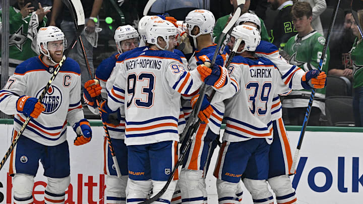 May 23, 2024; Dallas, Texas, USA; The Edmonton Oilers celebrates center Connor McDavid (97) scoring the game winning goal against the Dallas Stars during the second overtime period in game one of the Western Conference Final of the 2024 Stanley Cup Playoffs at American Airlines Center. Mandatory Credit: Jerome Miron-USA TODAY Sports