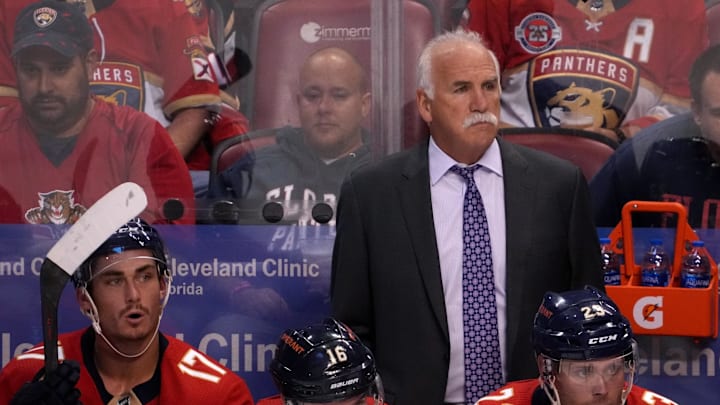 Oct 27, 2021; Sunrise, Florida, USA; Florida Panthers head coach Joel Quenneville stands behind the bench during the first period between the Florida Panthers and the Boston Bruins at FLA Live Arena. Mandatory Credit: Jasen Vinlove-Imagn Images