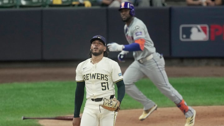 Milwaukee Brewers pitcher Freddy Peralta (51) watches a sacrifice fly hit by New York Mets outfielder Starling Marte (6) during the second inning of their wild-card playoff game Tuesday, October 1, 2024 at American Family Field in Milwaukee, Wisconsin.