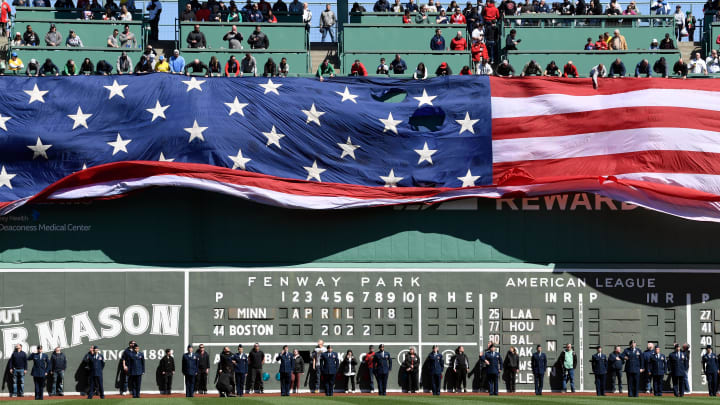 Apr 18, 2022; Boston, Massachusetts, USA; An American Flag is displayed over the Green Monster Apr 18, 2022; Boston, Massachusetts, USA; An American Flag is displayed over the Green Monster