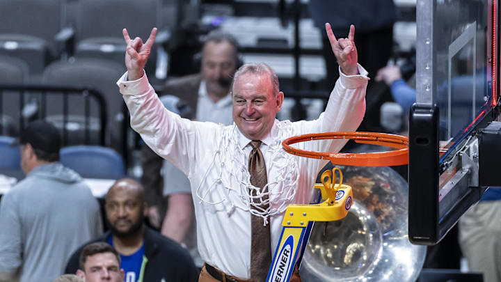 Mar 31, 2025; Birmingham, AL, USA; Texas Longhorns head coach Vic Schaefer waves to the fans after cutting the net following a win over the TCU Horned Frogs at an Elite 8 NCAA Tournament basketball game at Legacy Arena.