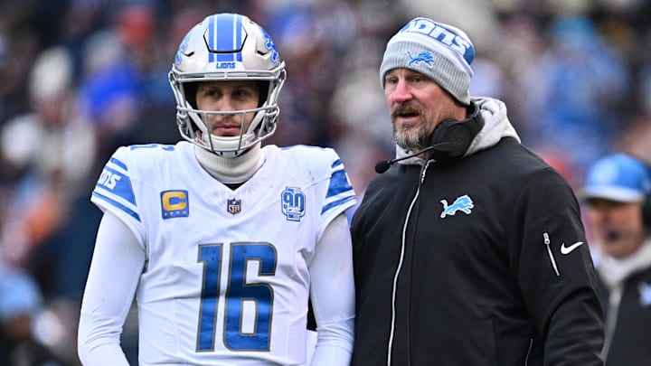 Dec 10, 2023; Chicago, Illinois, USA;  Detroit Lions head coach Dan Campbell talks with quarterback Jared Goff (16) in the first half against the Chicago Bears at Soldier Field. Mandatory Credit: Jamie Sabau-Imagn Images
