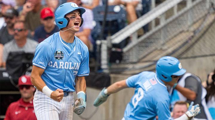 Jun 20, 2026; Omaha, NE, USA; North Carolina Tar Heels shortstop Jake Schaffner (2) celebrate after him and center fielder Owen Hull (8) score on a two-run single against the Oklahoma Sooners during the first inning at Charles Schwab Field. Mandatory Credit: Dylan Widger-Imagn Images