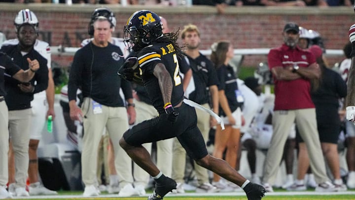 Sep 20, 2025; Columbia, Missouri, USA; Missouri Tigers wide receiver Marquis Johnson (2) runs the ball against the South Carolina Gamecocks during the first half of the game at Faurot Field at Memorial Stadium. Mandatory Credit: Denny Medley-Imagn Images