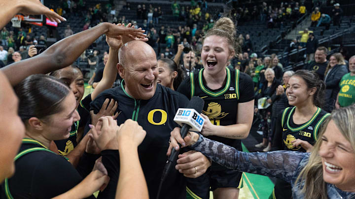 Oregon players mob coach Kelly Graves, center, during his TV interview after upsetting Baylor at Matthew Knight Arena in Eugene. Oregon players mob coach Kelly Graves, center, during his TV interview after upsetting Baylor at Matthew Knight Arena in Eugene.