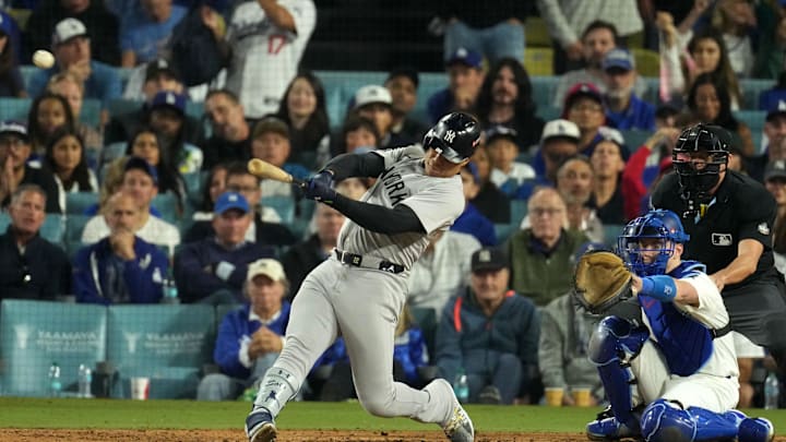 Oct 26, 2024; Los Angeles, California, USA; New York Yankees outfielder Juan Soto (22) hits a single against the Los Angeles Dodgers in the ninth inning for game two of the 2024 MLB World Series at Dodger Stadium. 