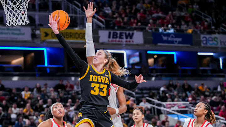 Iowa Hawkeyes guard Lucy Olsen (33) goes up for a basket Friday, March 7, 2025, in a quarterfinals game at the 2025 TIAA Big Ten Women's Basketball Tournament between the Iowa Hawkeyes and the Ohio State Buckeyes at Gainbridge Fieldhouse in Indianapolis. The Buckeyes defeated the Hawkeyes, 60-59.