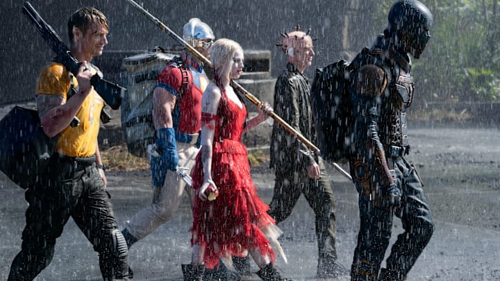 (L-r) JOEL KINNAMAN as Rick Flag, JOHN CENA as Peacemaker, MARGOT ROBBIE as Harley Quinn, PETER CAPALDI as The Thinker and IDRIS ELBA as Bloodsport in Warner Bros. Pictures’ action adventure “THE SUICIDE SQUAD,” a Warner Bros. Pictures release.. Photo: Jessica Miglio/™ & © DC Comics. © 2021 Warner Bros. Entertainment Inc. All Rights Reserved.