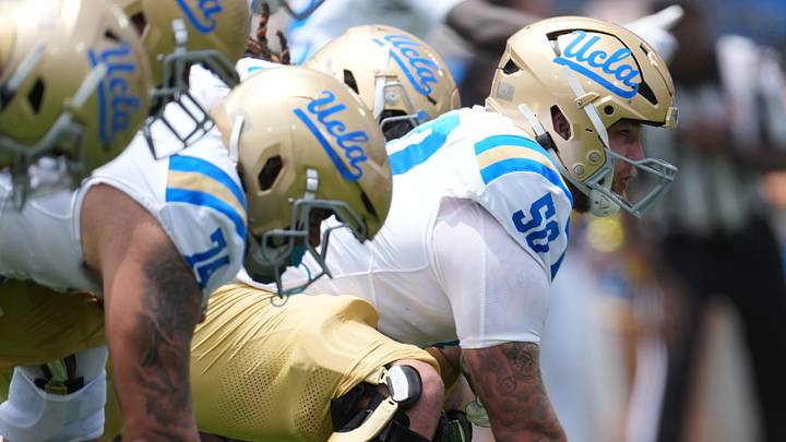 May 2, 2026; Pasadena, CA, USA; A general overall view of helmets at the line of scrimmage as UCLA Bruins center Riley Robell (50) snaps the ball during the spring game at Rose Bowl. Mandatory Credit: Kirby Lee-Imagn Images May 2, 2026; Pasadena, CA, USA; A general overall view of helmets at the line of scrimmage as UCLA Bruins center Riley Robell (50) snaps the ball during the spring game at Rose Bowl. Mandatory Credit: Kirby Lee-Imagn Images