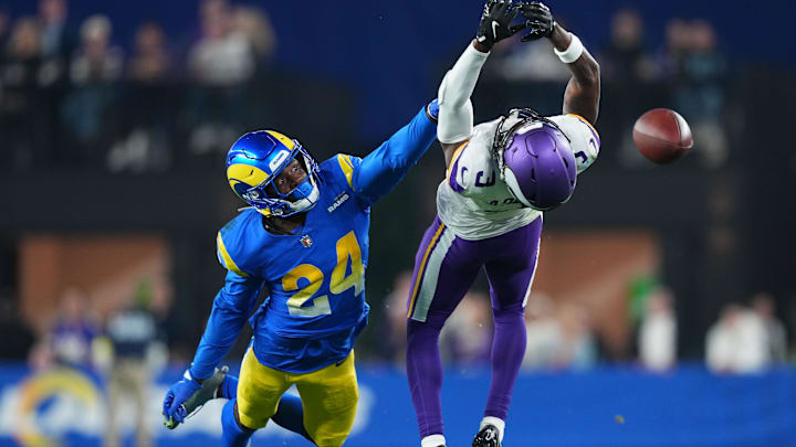 Jan 13, 2025; Glendale, AZ, USA; Minnesota Vikings wide receiver Jordan Addison (3) attempts to make a catch against Los Angeles Rams cornerback Darious Williams (24) during the second half in an NFC wild card game at State Farm Stadium. Mandatory Credit: Joe Camporeale-Imagn Images