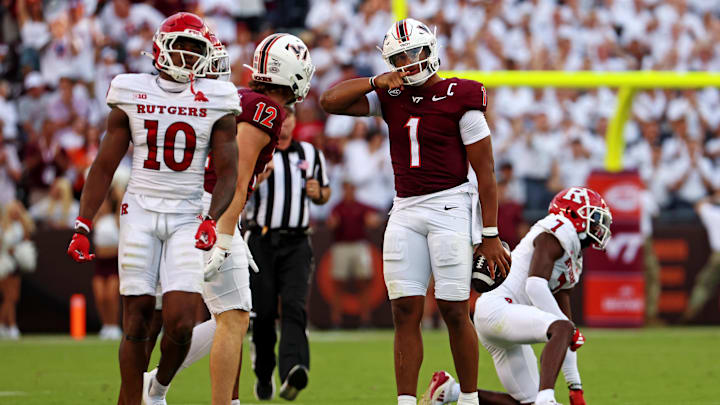 Sep 21, 2024; Blacksburg, Virginia, USA; Virginia Tech Hokies quarterback Kyron Drones (1) celebrates after getting a first down during the fourth quarter against the Rutgers Scarlet Knights at Lane Stadium. Mandatory Credit: Peter Casey-Imagn Images