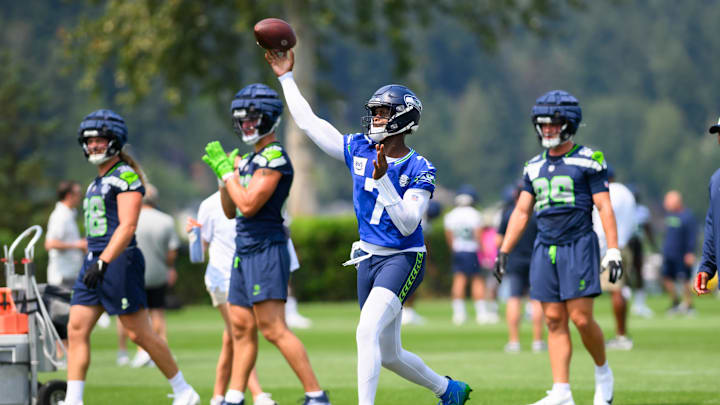 Jul 27, 2024; Renton, WA, USA; Seattle Seahawks quarterback Geno Smith (7) passes the ball during training camp at Virginia Mason Athletic Center. Mandatory Credit: Steven Bisig-Imagn Images