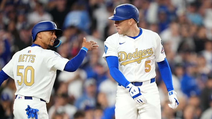 Mar 28, 2025; Los Angeles, California, USA; Los Angeles Dodgers first baseman Freddie Freeman (5) is congratulated by shortstop Mookie Betts (50) after hitting a two-run home run in the sixth inning against the Detroit Tigers at Dodger Stadium. Mandatory Credit: Kirby Lee-Imagn Images Mar 28, 2025; Los Angeles, California, USA; Los Angeles Dodgers first baseman Freddie Freeman (5) is congratulated by shortstop Mookie Betts (50) after hitting a two-run home run in the sixth inning against the Detroit Tigers at Dodger Stadium. Mandatory Credit: Kirby Lee-Imagn Images
