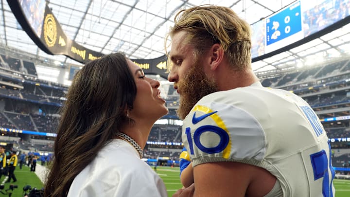 Los Angeles Rams wide receiver Cooper Kupp kisses wife Anna Kupp during the game against the Minnesota Vikings.