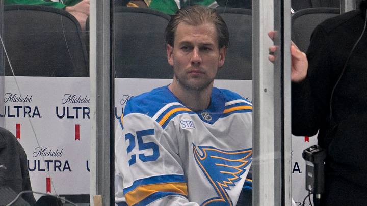 Oct 2, 2026; Dallas, Texas, USA; St. Louis Blues defenseman Brandon Carlo (25) looks on from the penalty box as a knee on knee hit is reviewed for Carlo hit on Dallas Stars center Roope Hintz (not pictured) during the third period at the American Airlines Center. Mandatory Credit: Jerome Miron-Imagn Images Oct 2, 2026; Dallas, Texas, USA; St. Louis Blues defenseman Brandon Carlo (25) looks on from the penalty box as a knee on knee hit is reviewed for Carlo hit on Dallas Stars center Roope Hintz (not pictured) during the third period at the American Airlines Center. Mandatory Credit: Jerome Miron-Imagn Images