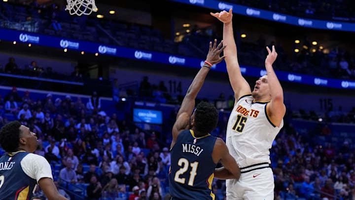 Nikola Jokic shoots the ball