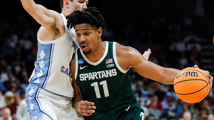 Michigan State guard A.J. Hoggard (11) dribbles against North Carolina guard Cormac Ryan (3) during