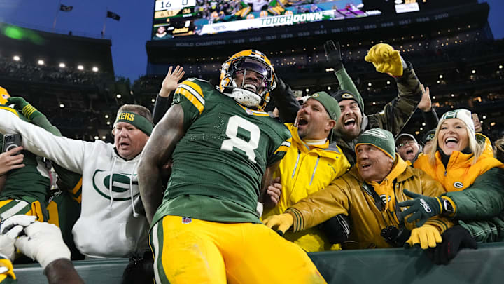 Green Bay Packers running back Josh Jacobs (8) celebrates after scoring a touchdown against the San Francisco 49ers.