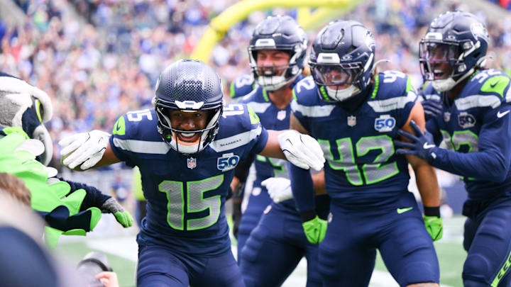 Sep 21, 2025; Seattle, Washington, USA; Seattle Seahawks wide receiver Tory Horton (15) celebrates after scoring a 95-yard punt return for a touchdown against the New Orleans Saints during the first quarter at Lumen Field.