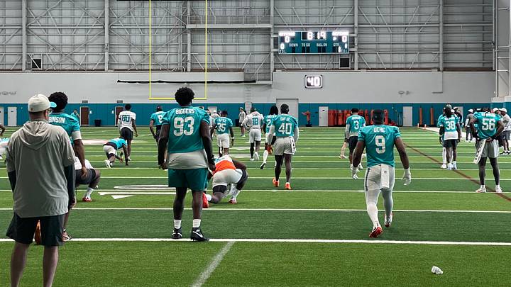 The Miami Dolphins stretch before their first minicamp practice of 2026 The Miami Dolphins stretch before their first minicamp practice of 2026