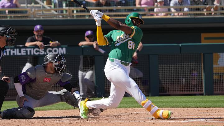 Mar 6, 2026; Mesa, Arizona, USA; Athletics shortstop Leo de Vries (83) hits against the Colorado Rockies in the second inning at Hohokam Stadium. Mandatory Credit: Rick Scuteri-Imagn Images