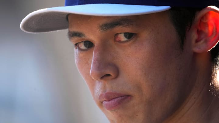 Mar 3, 2026; Goodyear, Arizona, USA; Los Angeles Dodgers starting pitcher Roki Sasaki (11) looks on against the Cleveland Guardians during the first inning at Goodyear Ballpark. Mandatory Credit: Joe Camporeale-Imagn Images