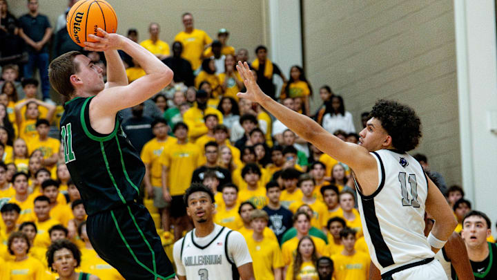 St. Mary's Knights Mick Riordan (11) shoots a jumper over Millennium Tigers DJ Spencer (11) during the open division semifinals at Chaparral High School in Scottsdale, on March 4, 2026.